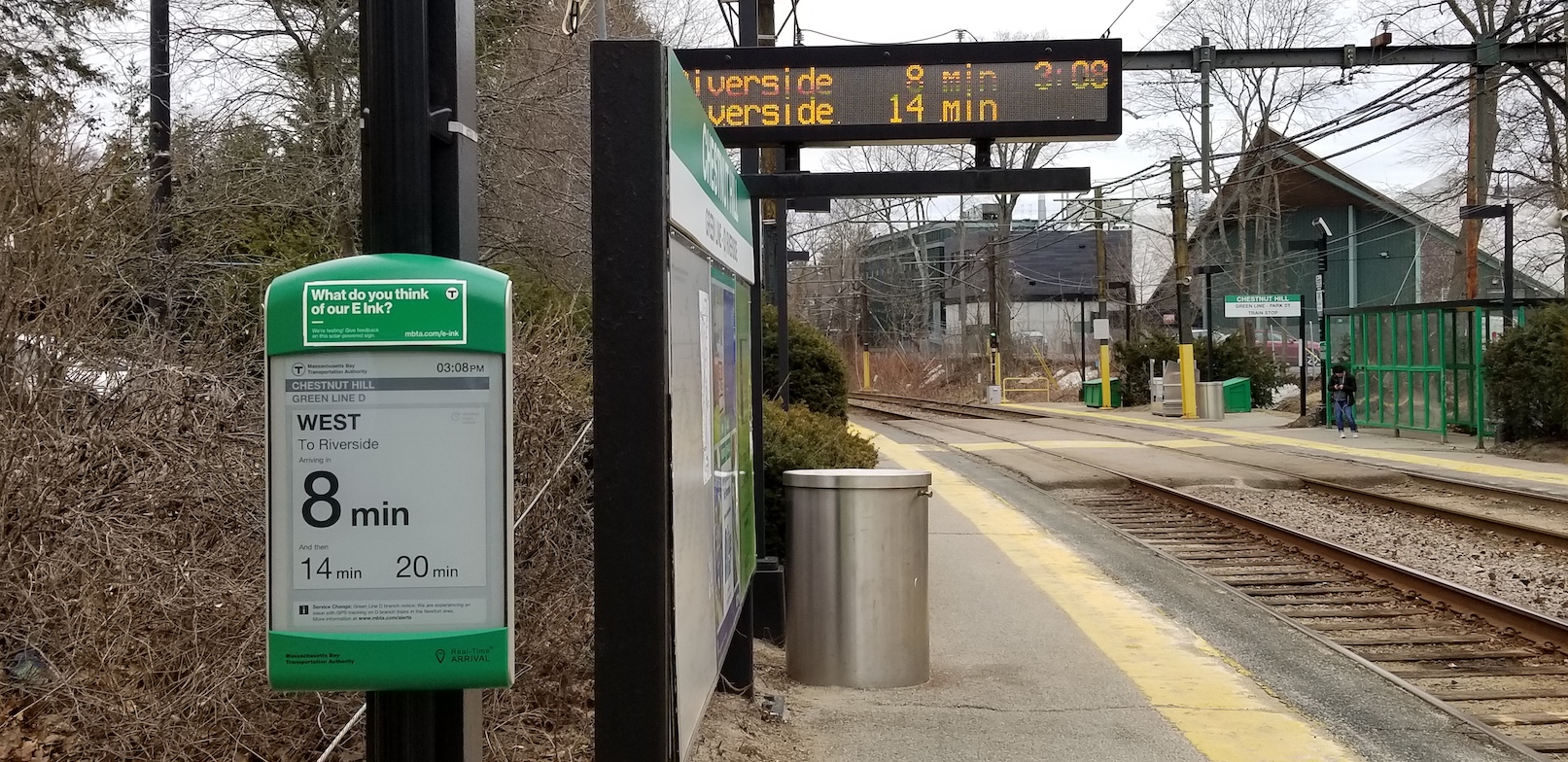 An e-Ink sign on the westbound platform at Chestnut Hill