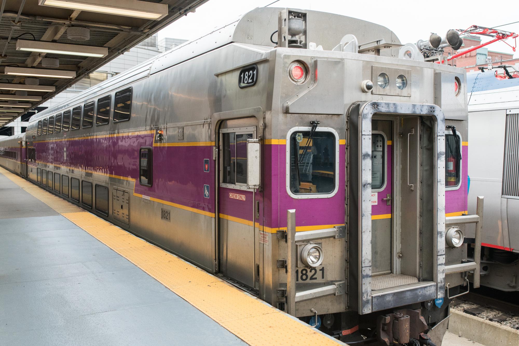 Commuter rail train at a station platform.