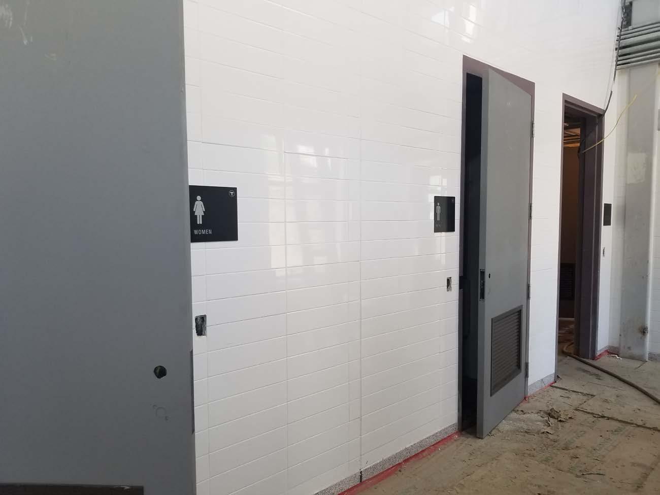 Installation of bathroom doors and signs complete (July 8, 2019)