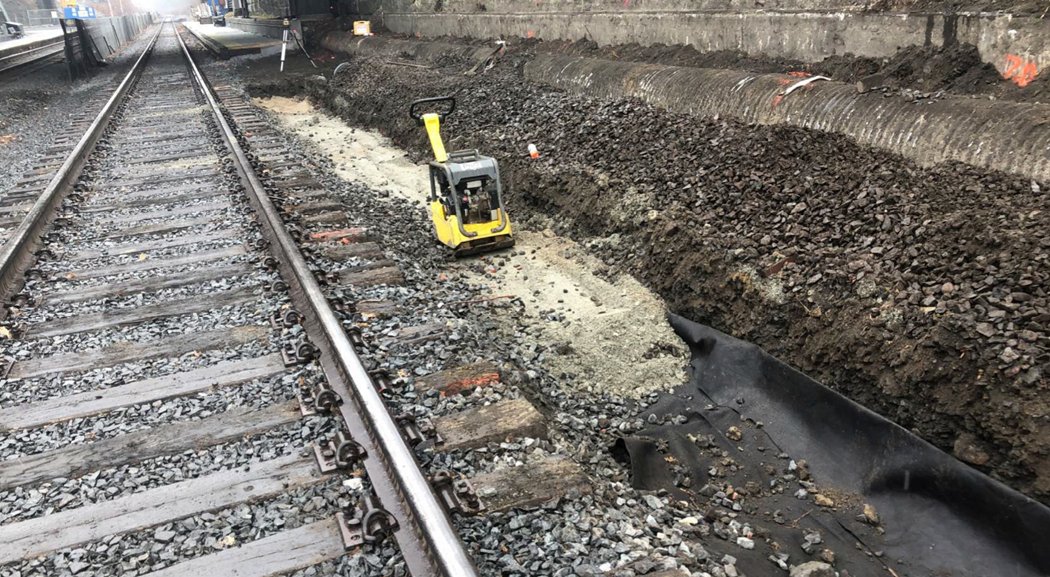 The western inbound portion of the rail, shown with a construction tool to the right of it 