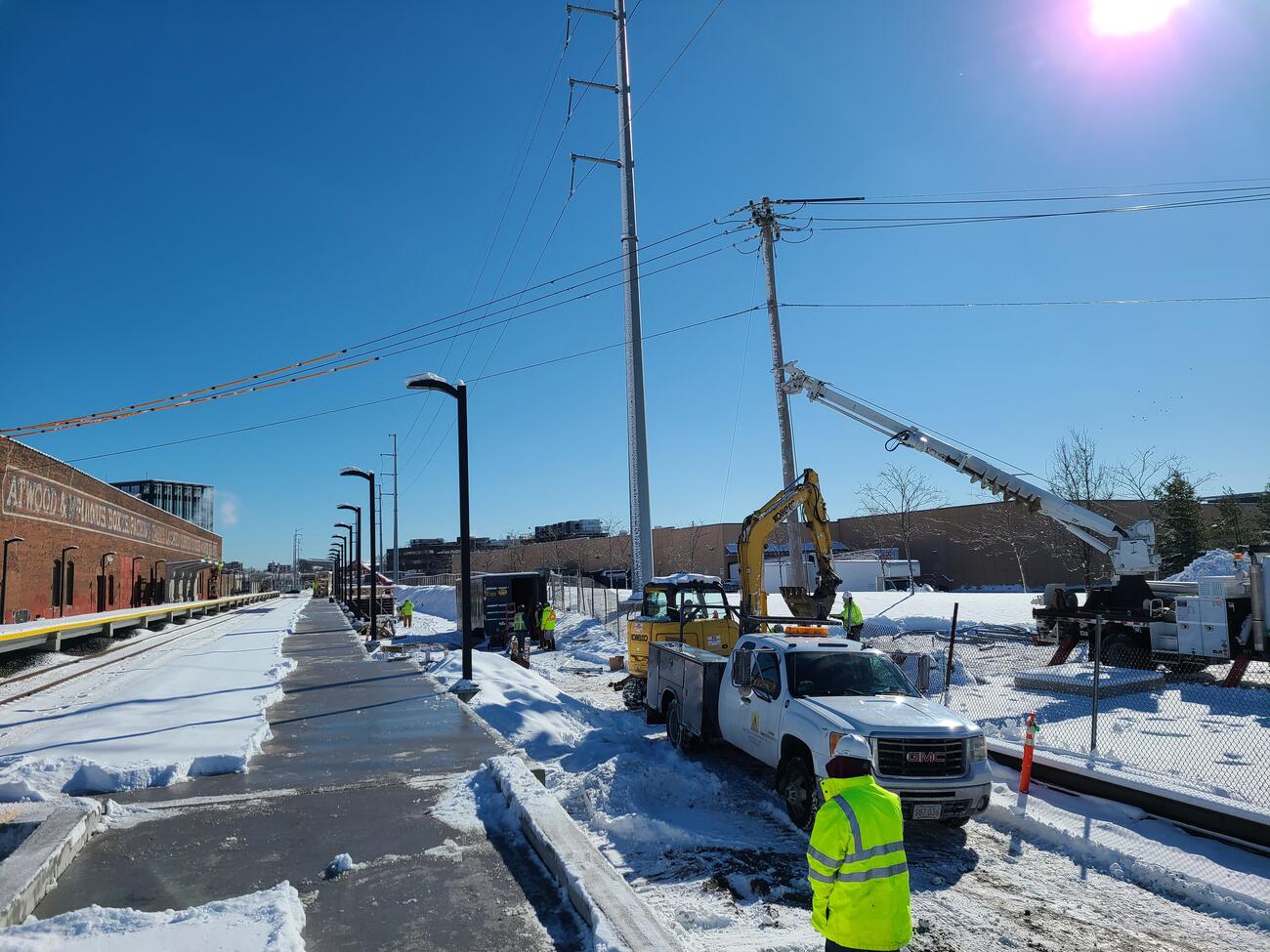 Crews installing part of new electrical service in the area of the outbound platform for the new Chelsea Commuter Rail Station