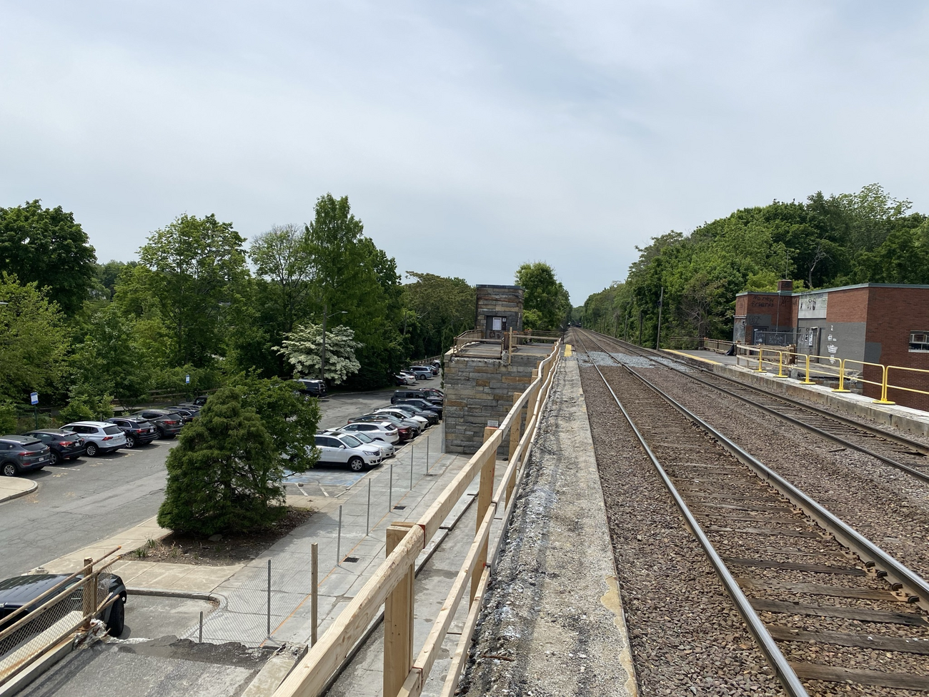 View of canopy and ramp removal at the Aberjourna parking lot on the south end's outbound side of Winchester Station, looking down from the station platform (June 2021). 