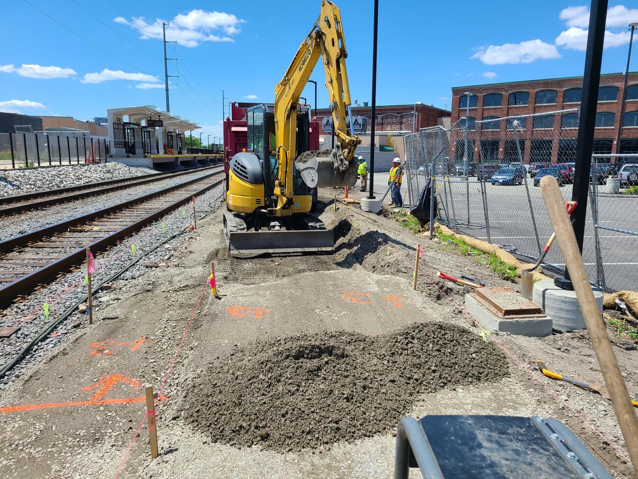 Crews lay crushed stone to build the northeast walkway to the new Chelsea Commuter Rail Station.