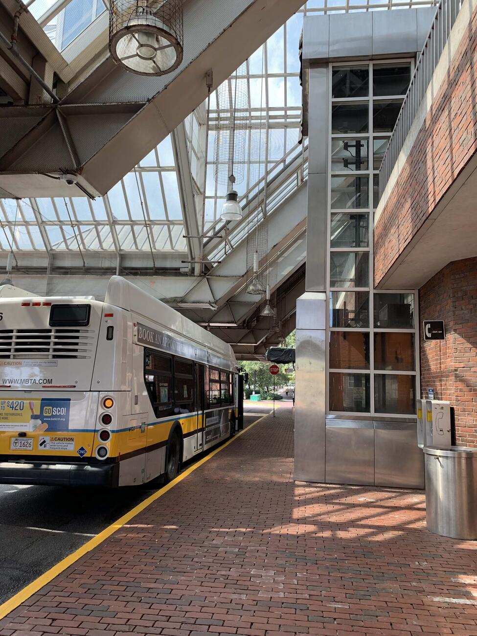 A bus waiting at Forest Hills Station