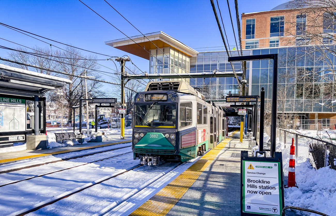 a Green Line train waits at Brookline Hills station