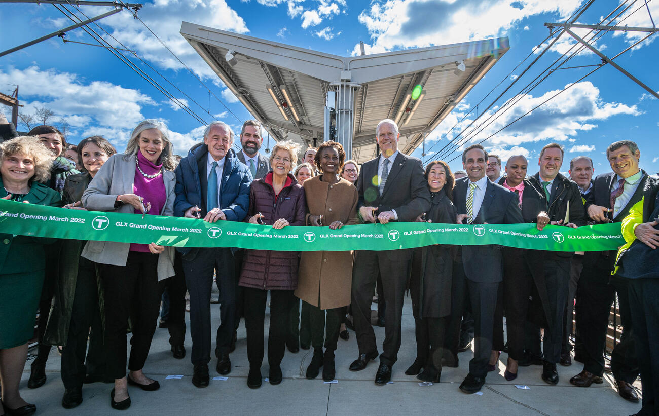 A group of elected officials and community activists cut a ceremonial ribbon at Lechmere (March 2022)
