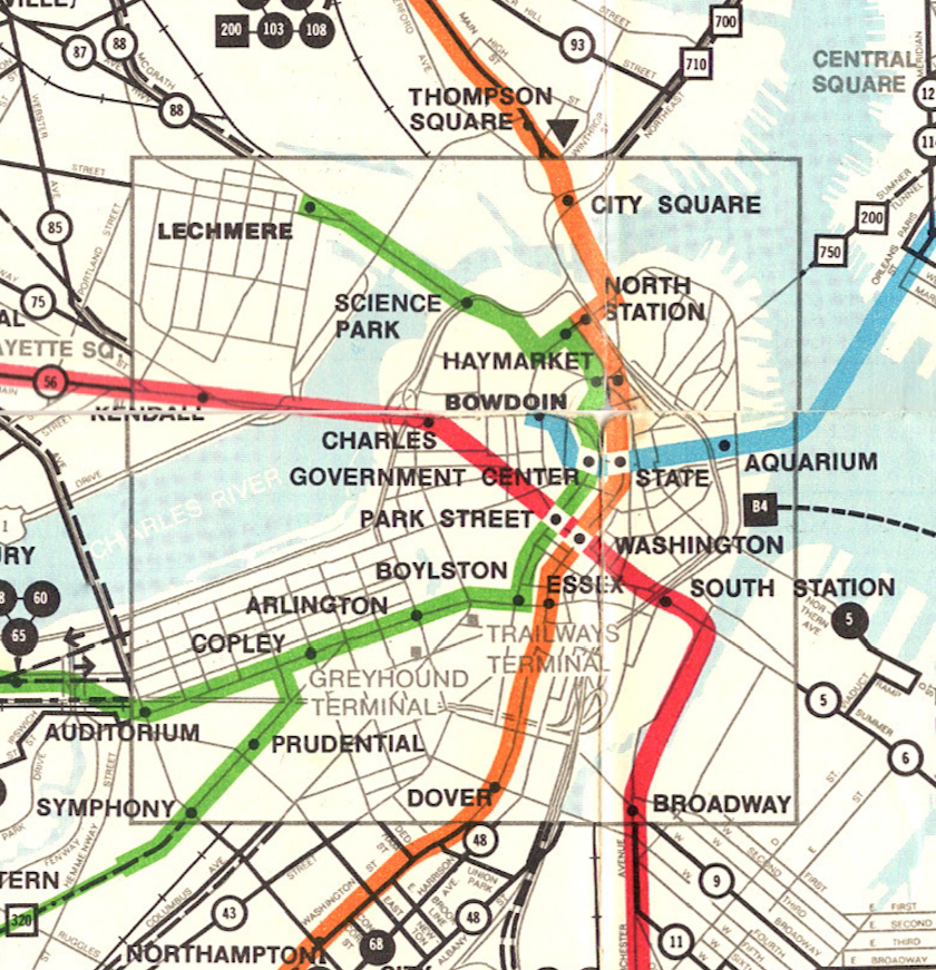A detail from a full map with an overview of all MBTA services in the Greater Boston area. The detail zooms in on Boston Proper and overlays the four colored subway and trolley lines over a simplified map of Boston. 