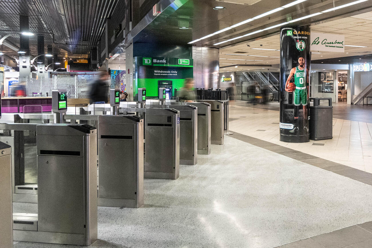 Empty North Station concourse and new fare gates 