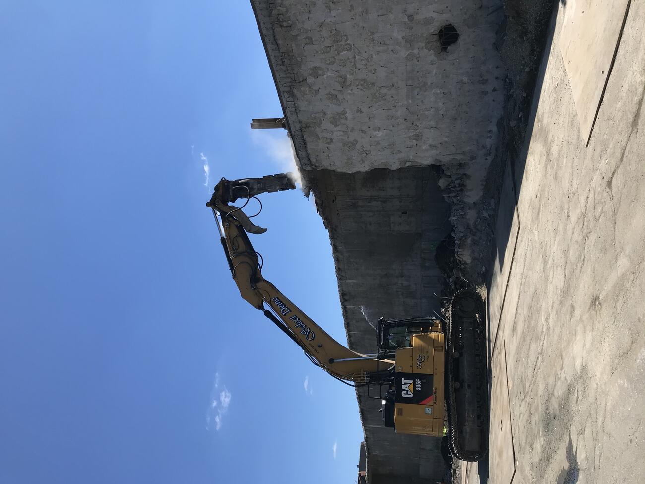 Construction vehicle demolishing wall at Laraway Lot (July 2022)