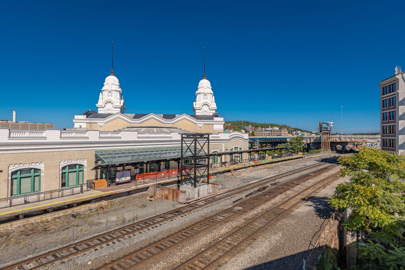 View of elevator shaft next to train tracks and building