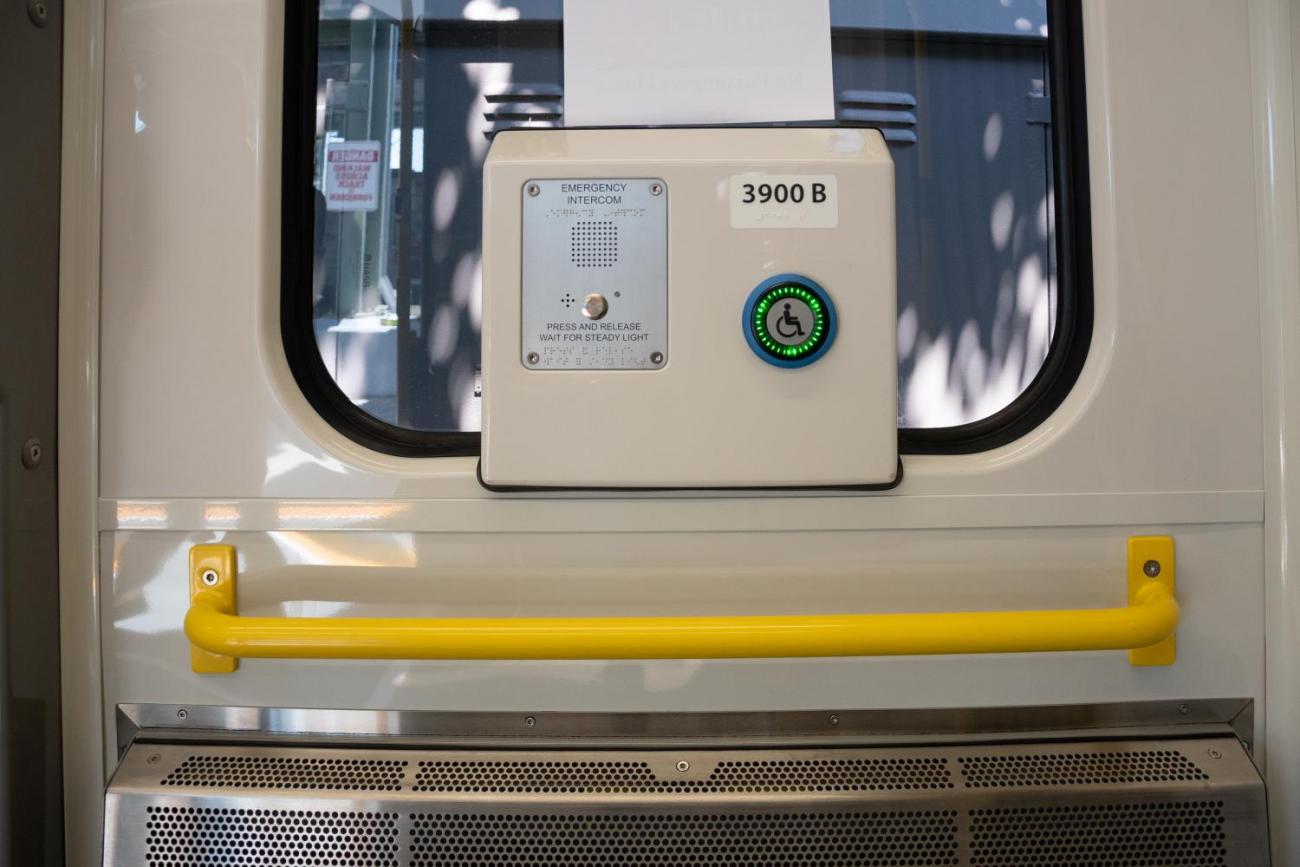 Intercom and yellow grab railing on new Green Line car (July 2018)