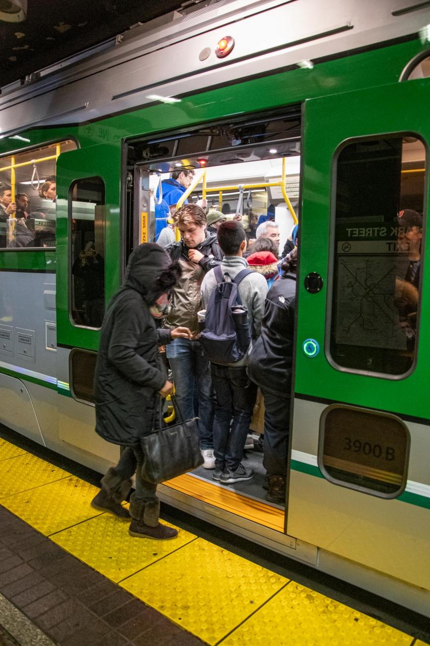 Passengers at North Station board the first new Green Line vehicle in service (December 21, 2018).