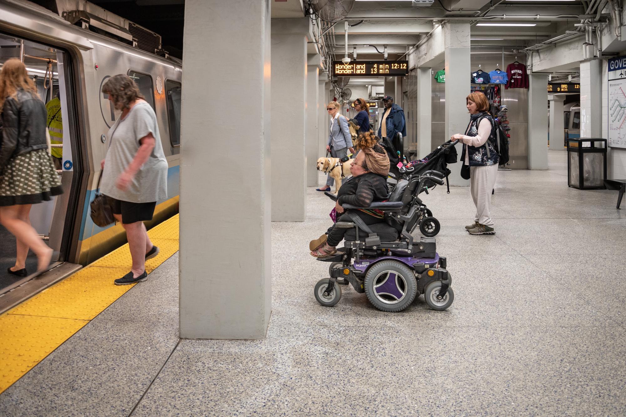 customers waiting to board blue line