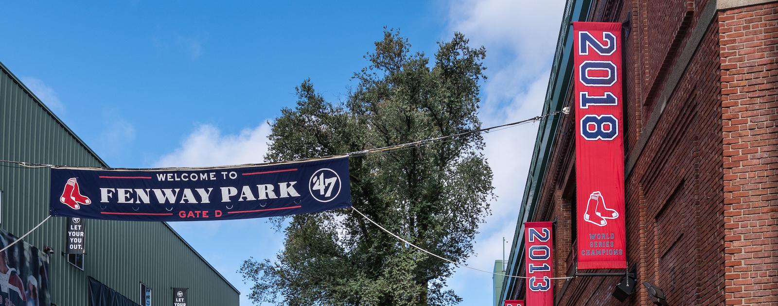 Banners hanging outside of Fenway Park, celebrating the years the Sox won the World Series