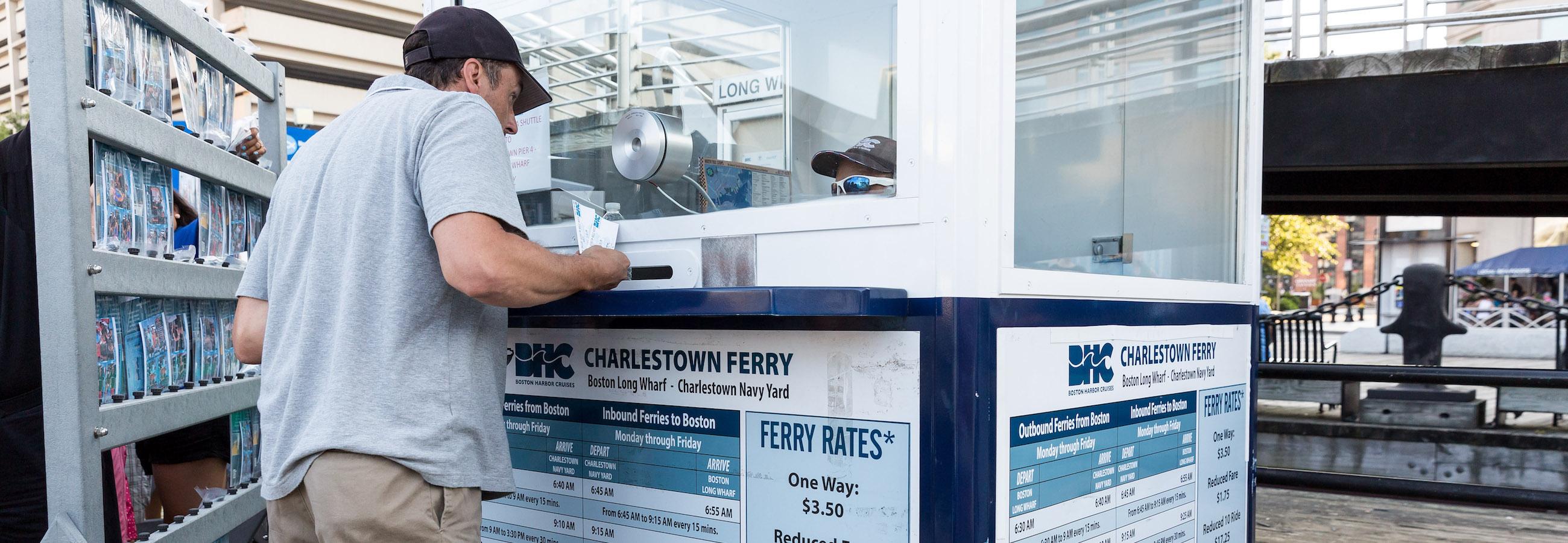 customer buying tickets for charlestown ferry