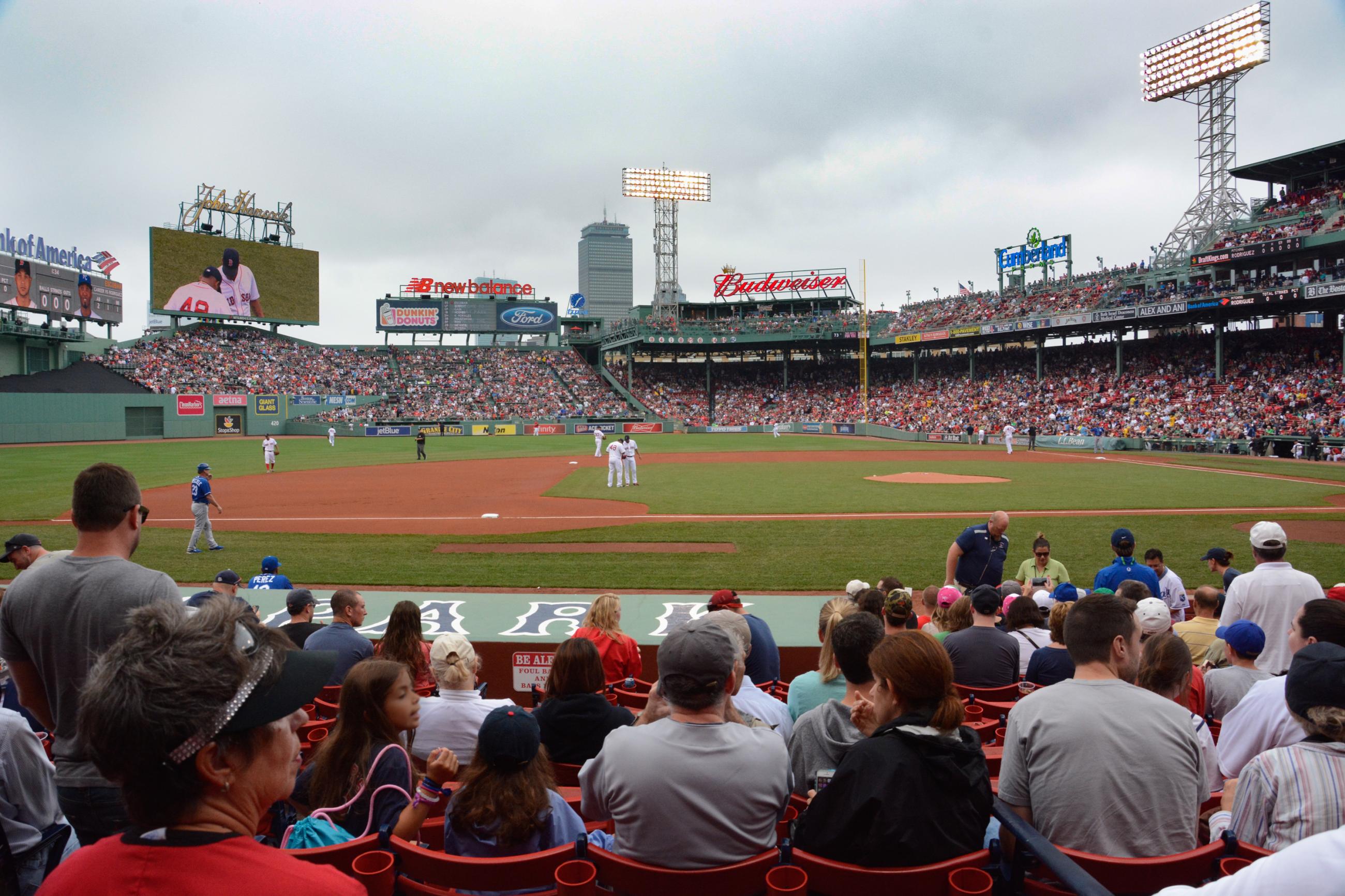 Fenway Park during a baseball game, viewing the playing field from the stands