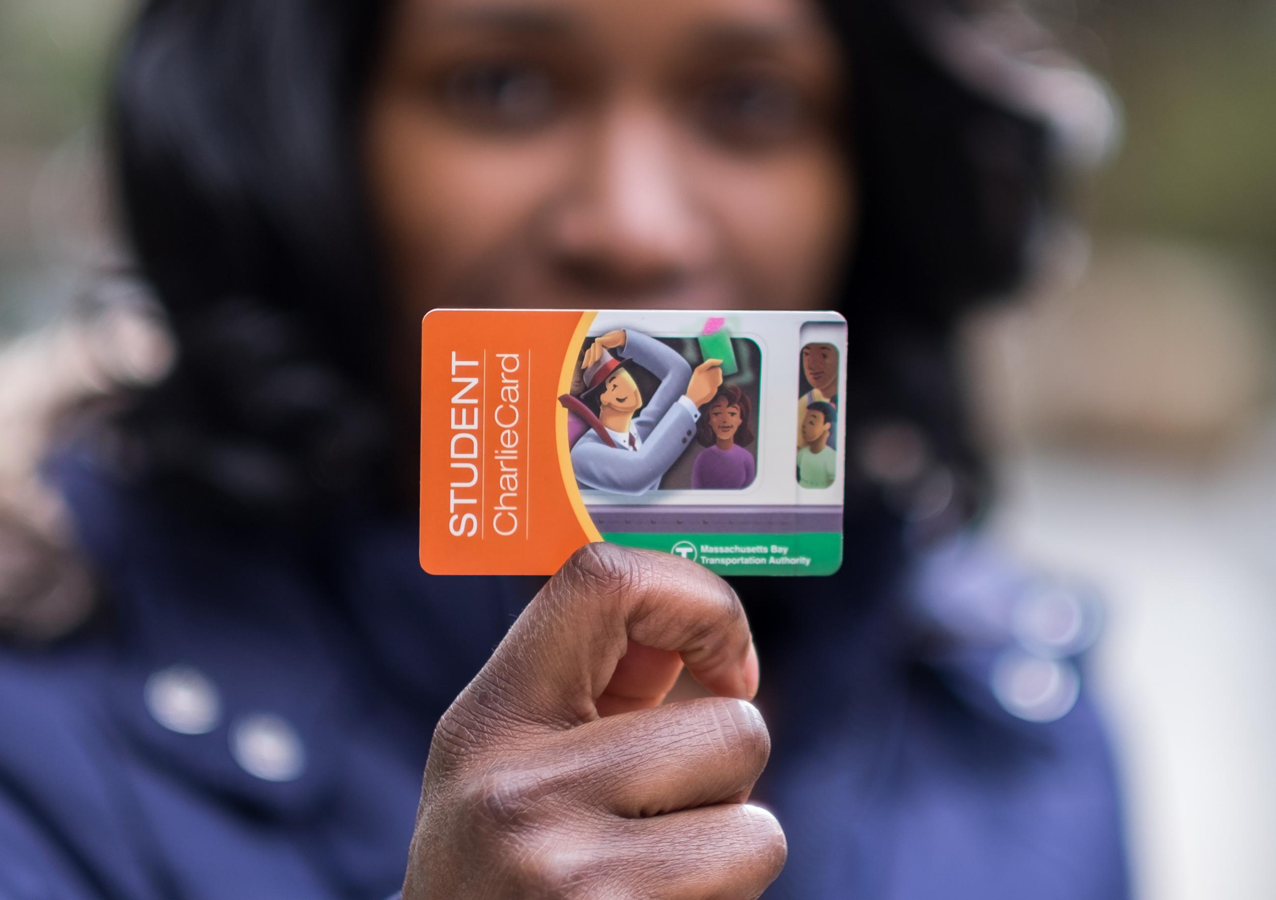 Woman holding a Student CharlieCard