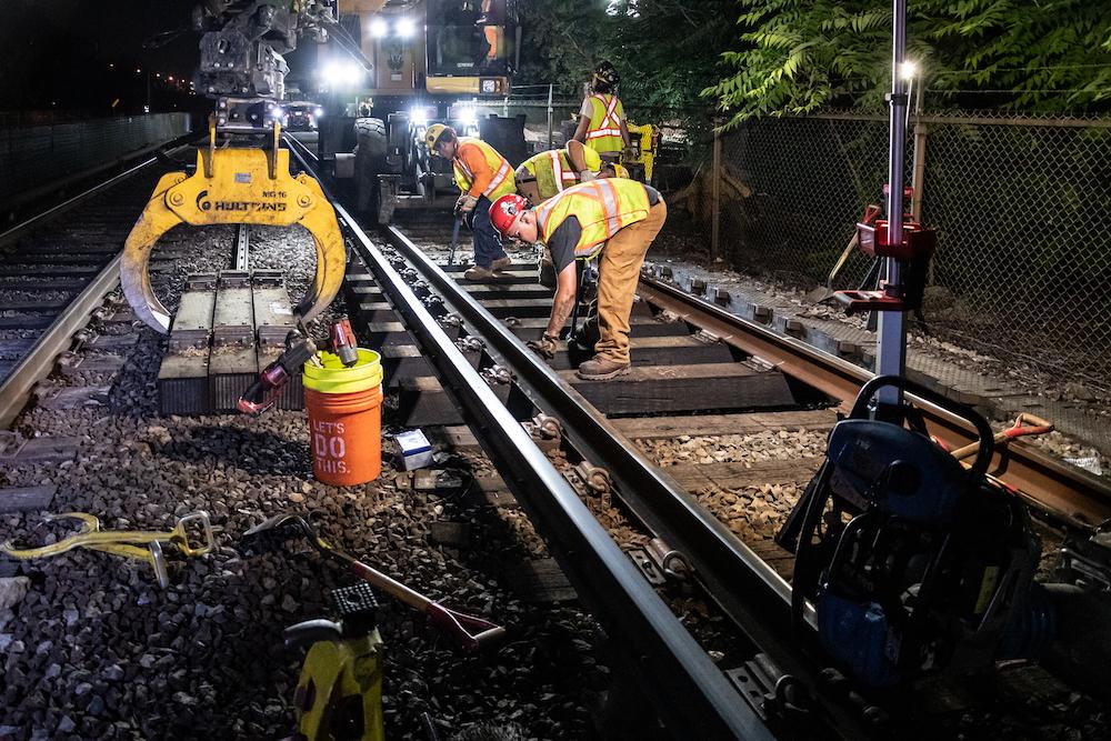 A crew works on the Orange Line in Medford