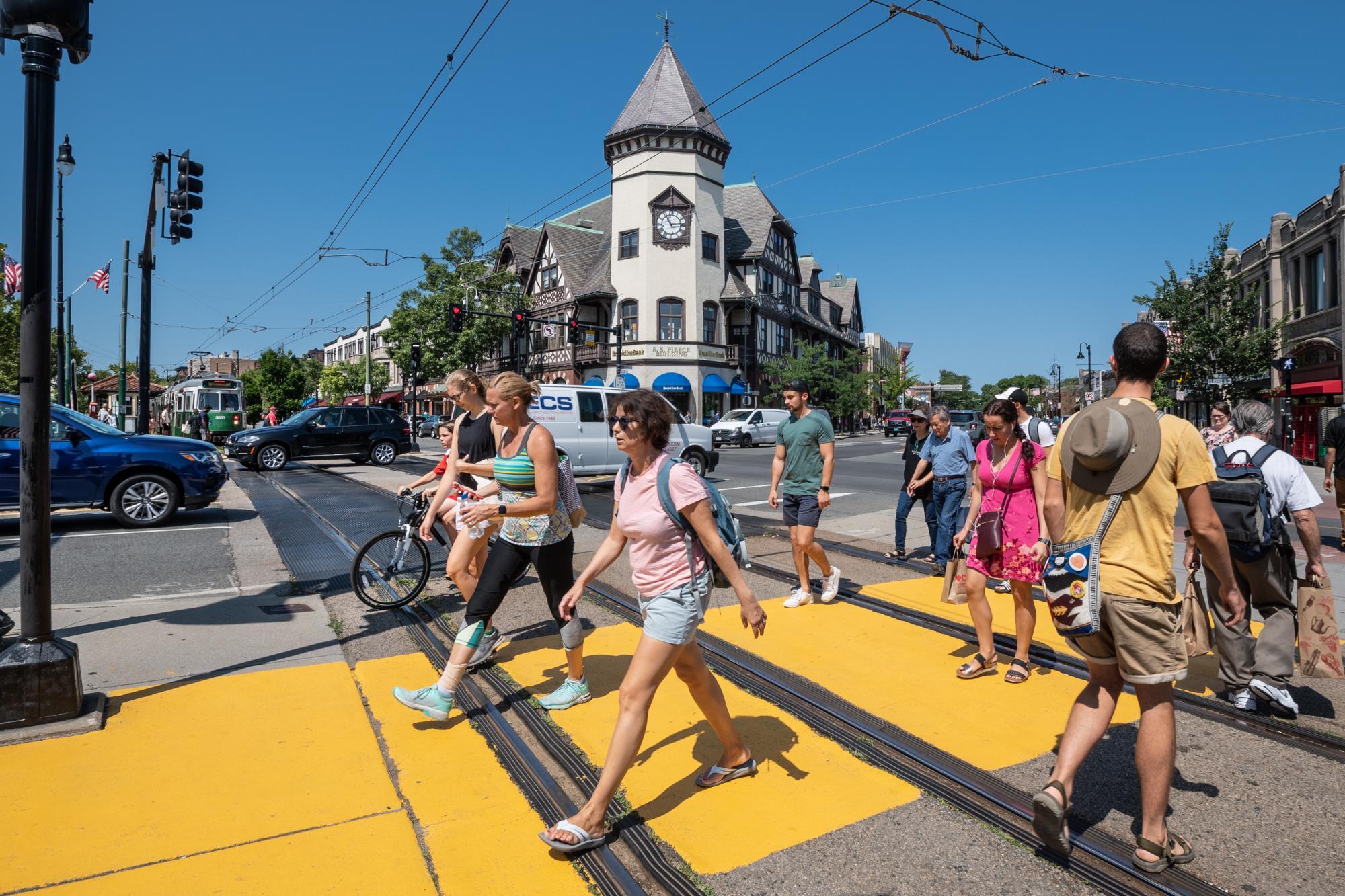 Pedestrians cross the newly repainted crosswalk at Coolidge Corner (August 2019)