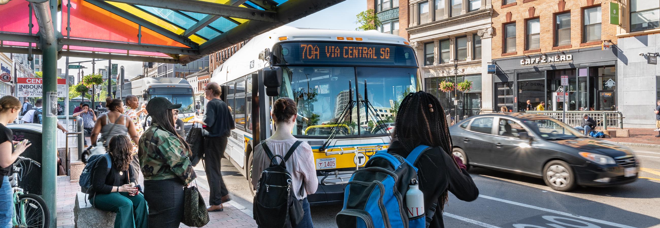 customers waiting at bus stop in central square