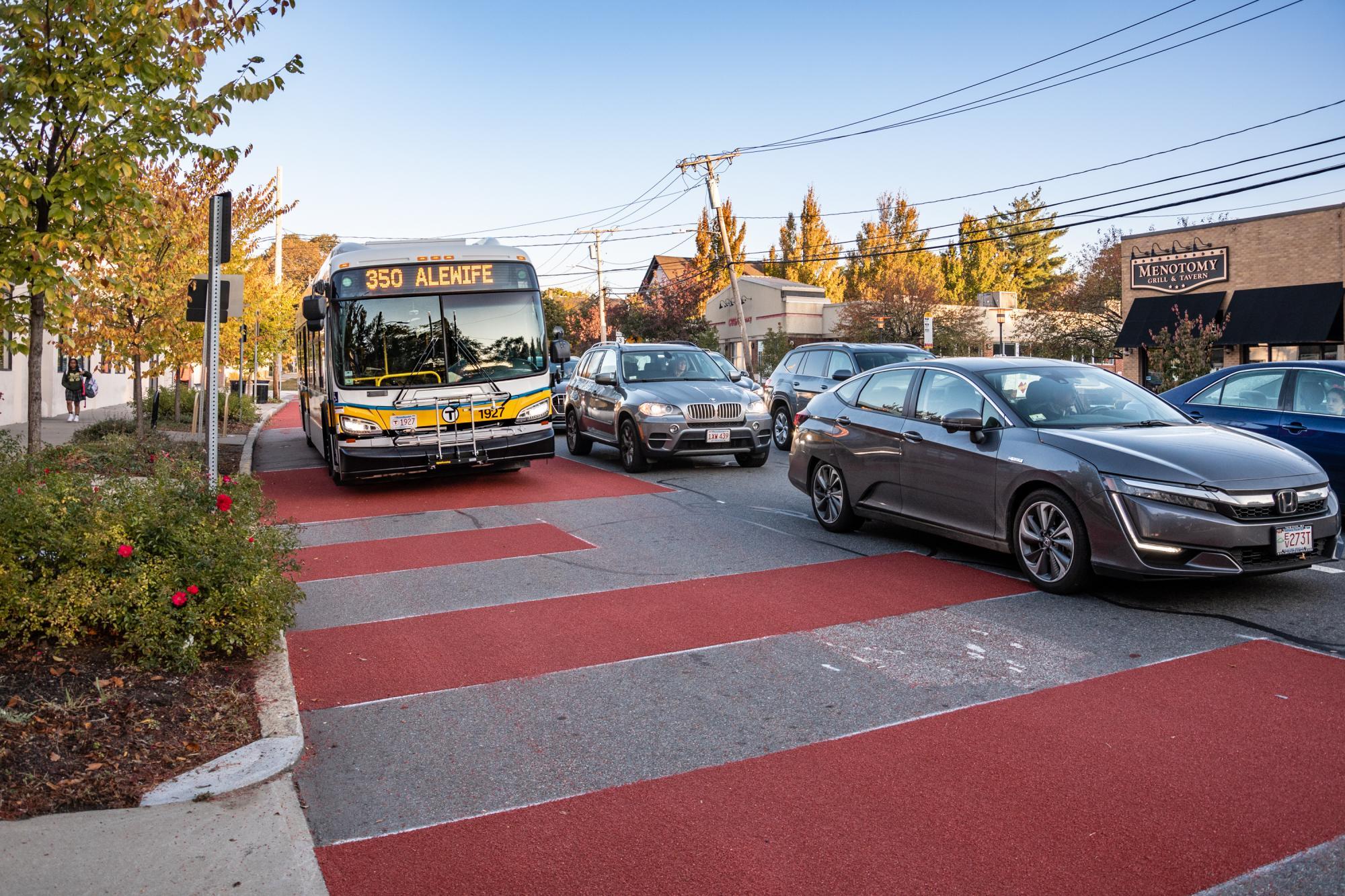 A closeup of a bus approaching in the new bus lane on Mass Ave in Arlington
