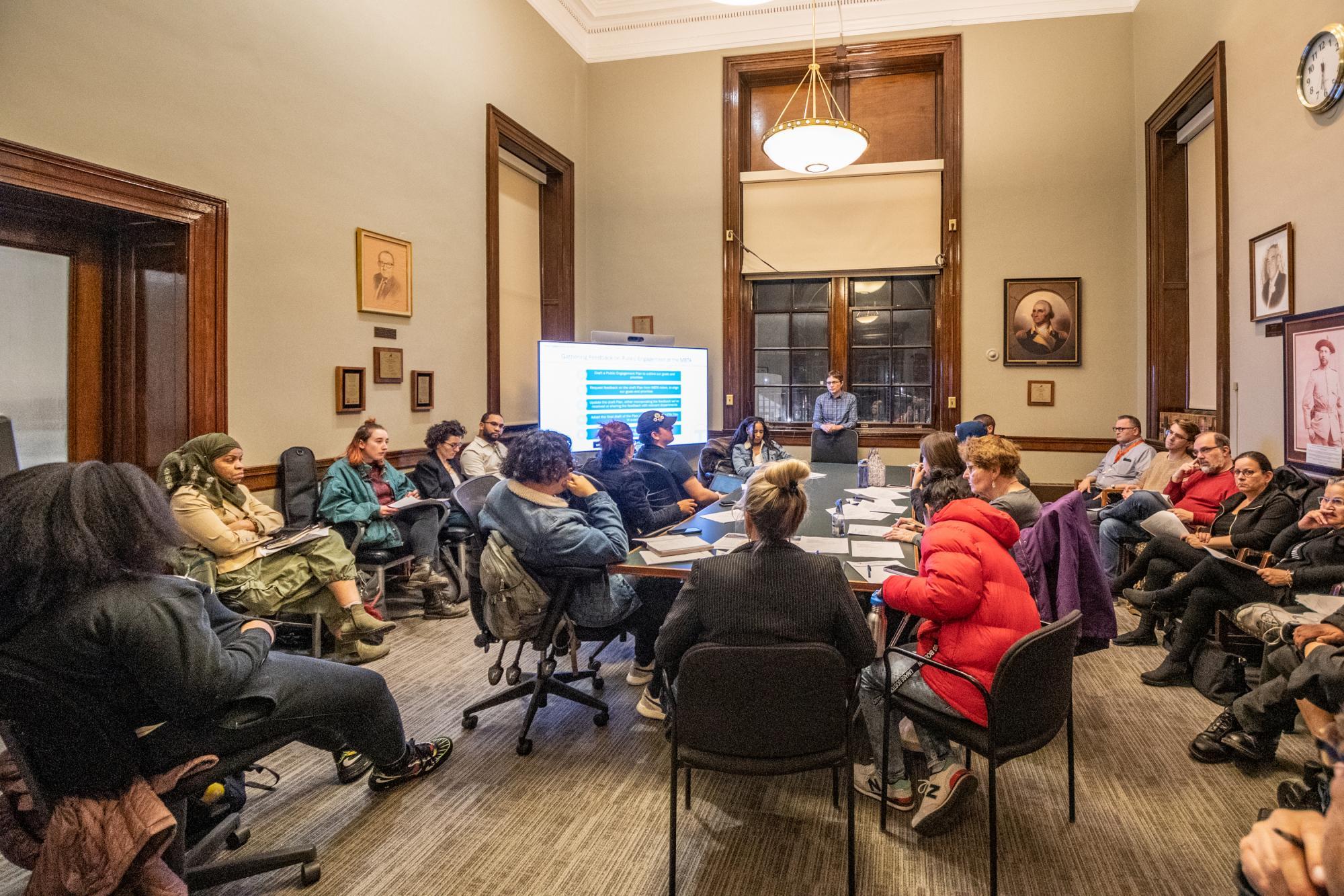 Community members gather in a conference room at Chelsea City Hall to dicsuss the public engagement plan.
