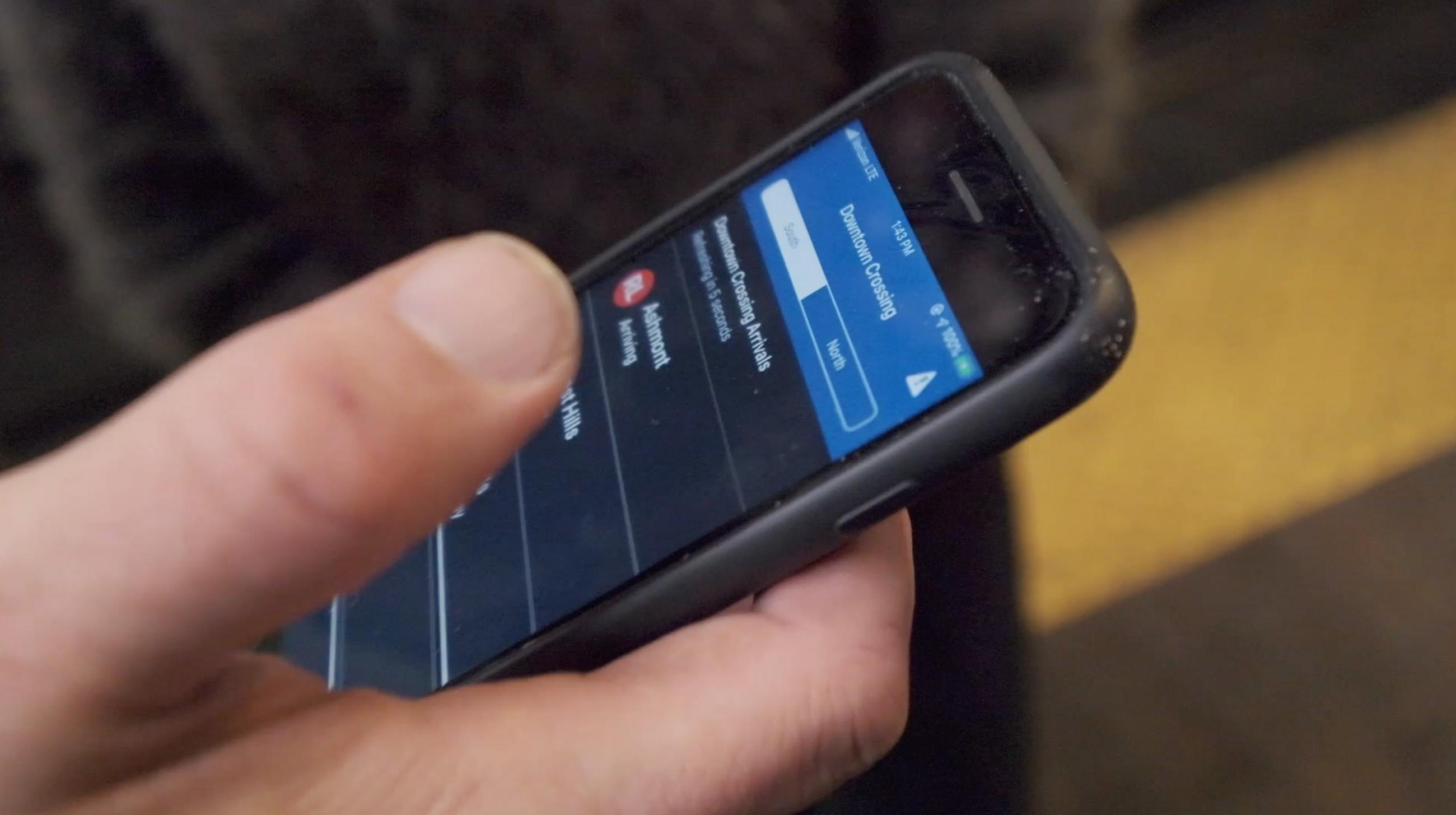 A rider uses an app that provides audio-equivalency for digital signs as part of a technology we’re developing for blind and low-vision riders