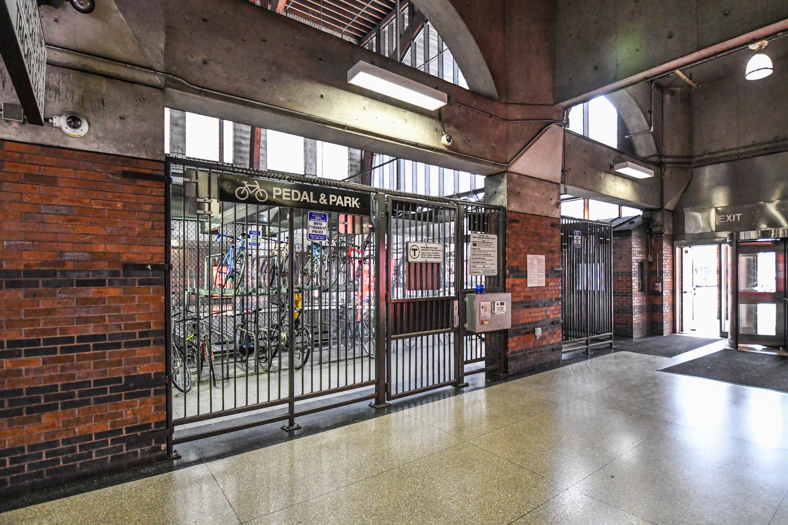 A pedal and park bike facility with bikes locked inside at Back Bay station