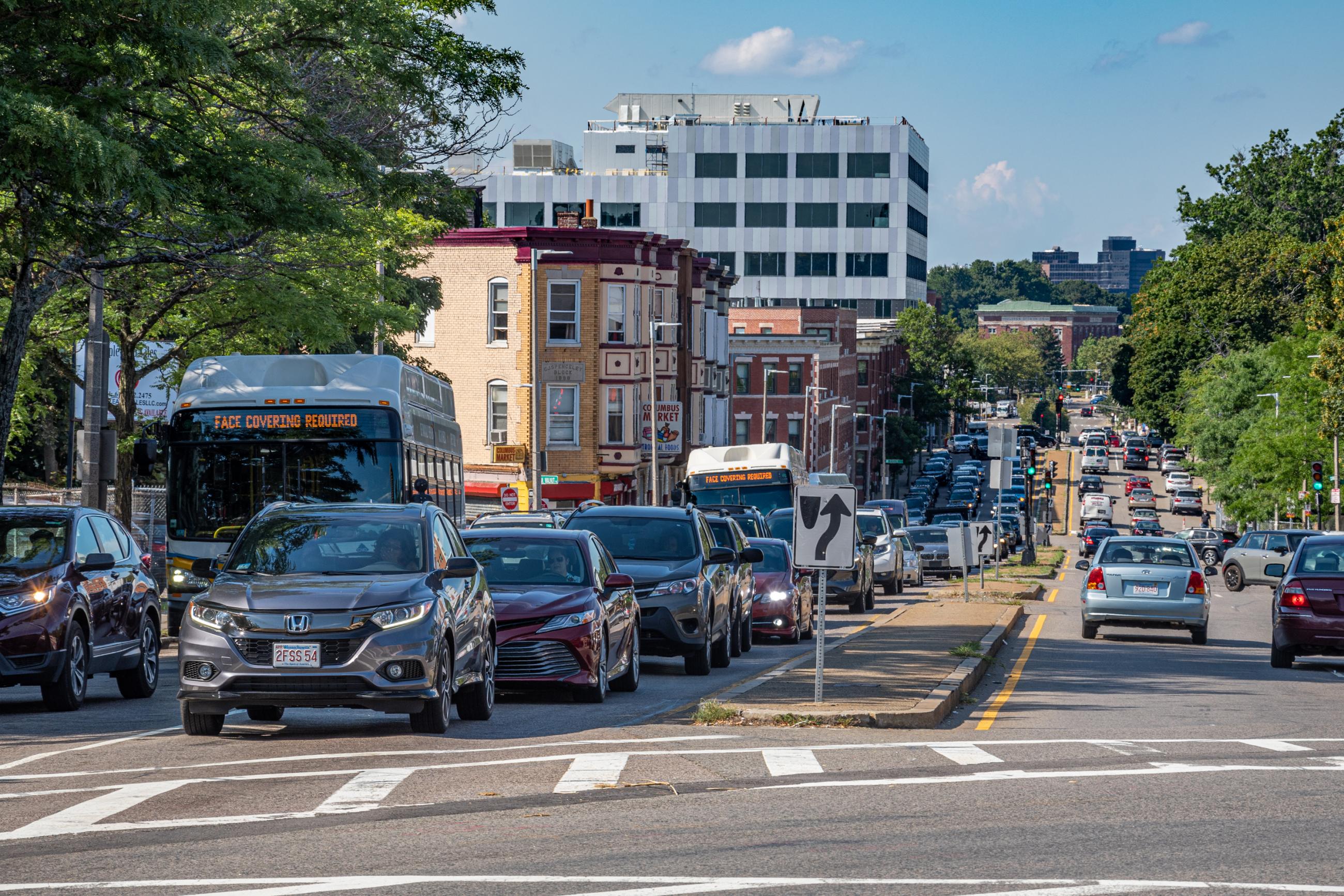 Buses caught in traffic on Columbus Avenue during rush hour.