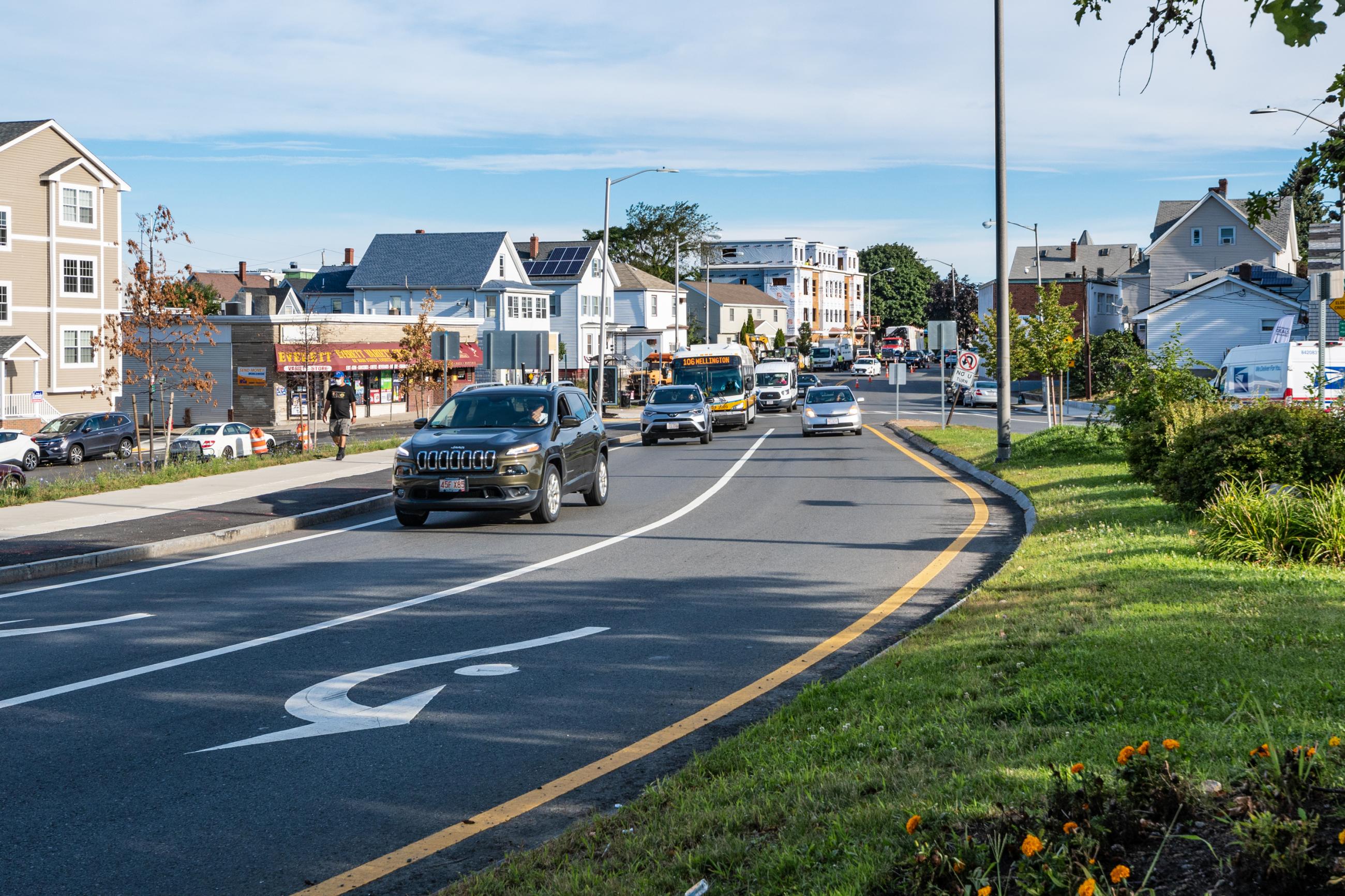 View of Sweester Circle from Main Street. Partially cloudy summer day with light traffic conditions.