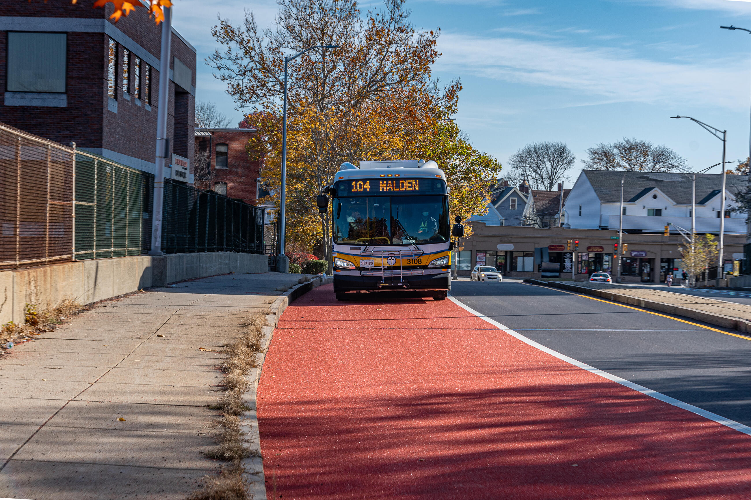 Route 104 bus using the new Florence Street bus lane approaching Malden Center Station.