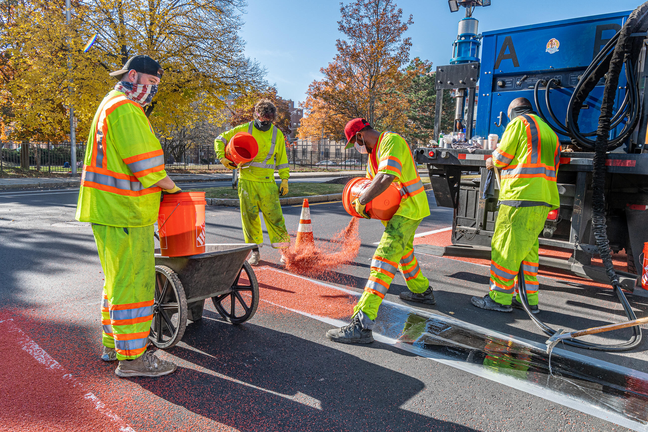 Road crews installing the Florence Street bus lane on November 9, 2020. 