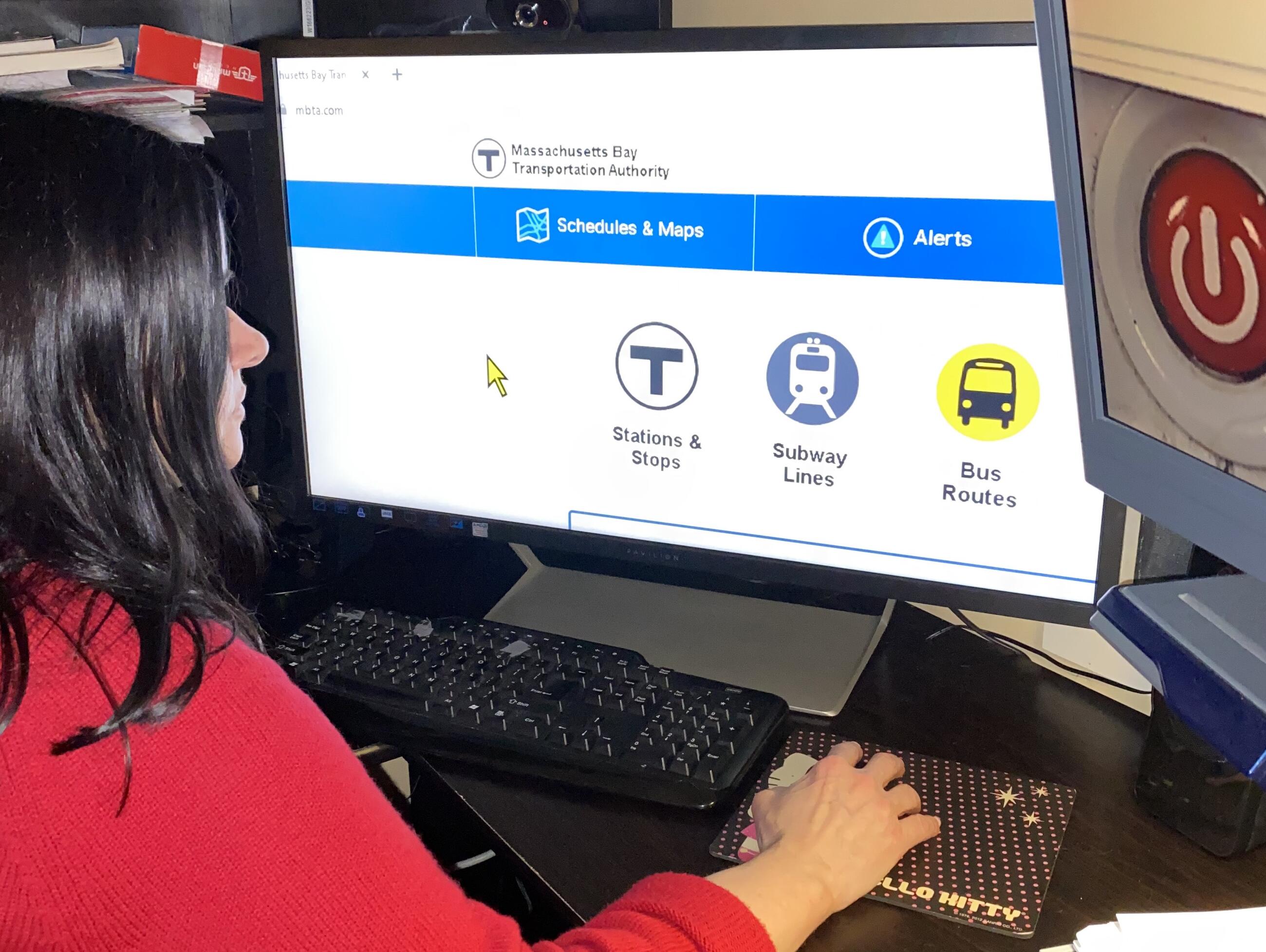 a woman using assistive technology to access mbta.com