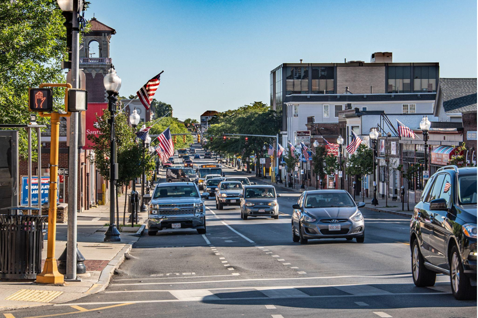 A Route 116 bus travels in mixed traffic along Broadway near Yeamans Street in Revere before construction of a southbound AM bus lane in 2020.