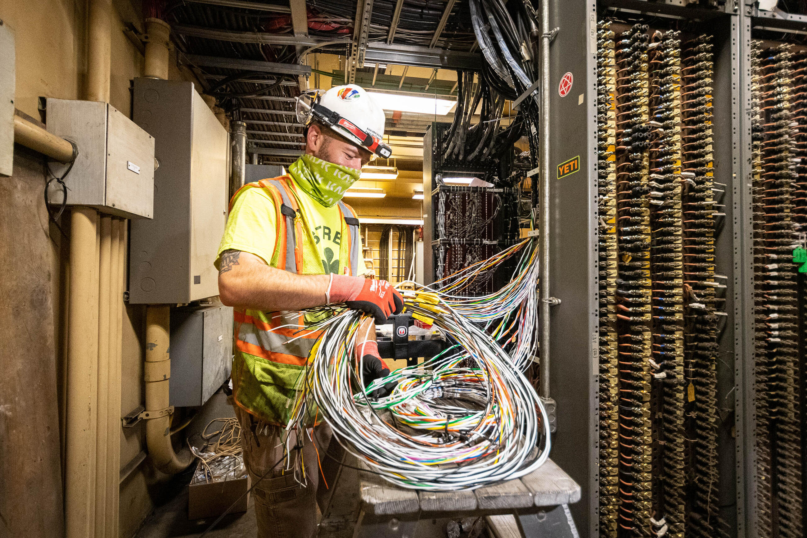 a construction worker with signal wires at Harvard