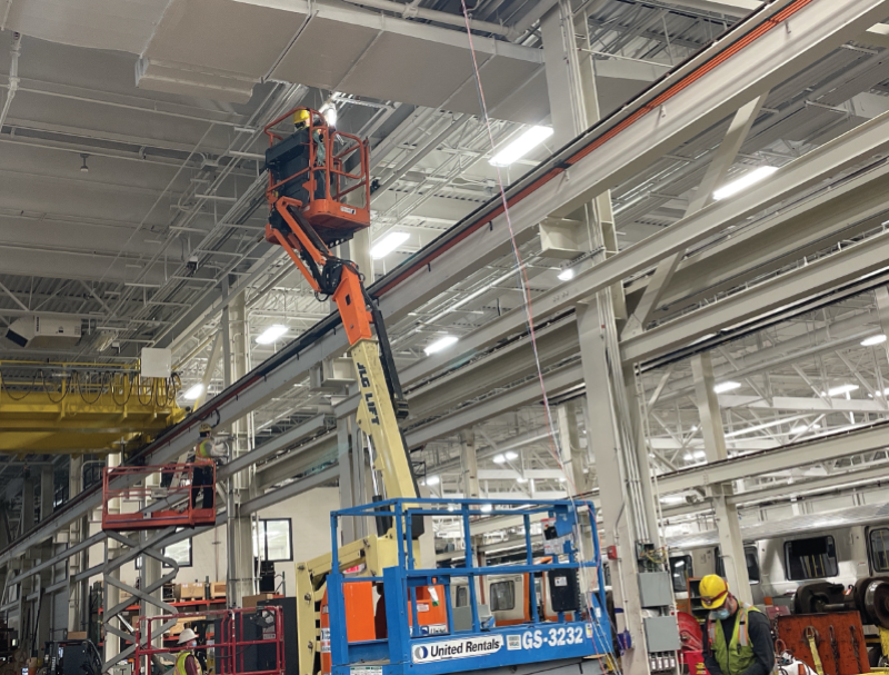 Crews work on the Wellington Vehicle Maintenance Facility as part of the Orange Line Transformation