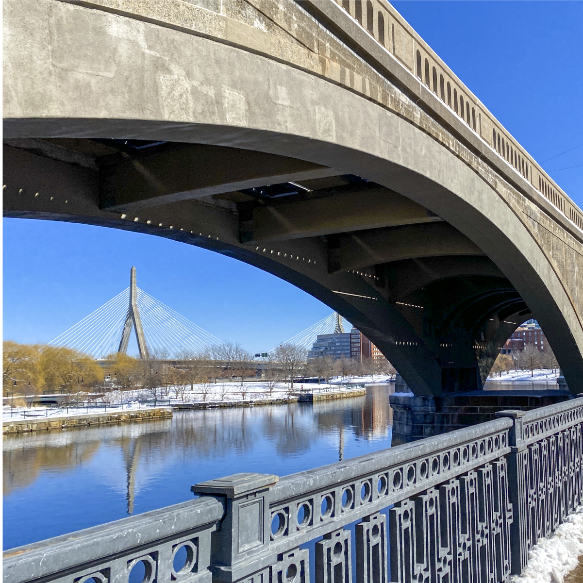 a bridge arch over the lechmere viaduct on a clear blue sky day