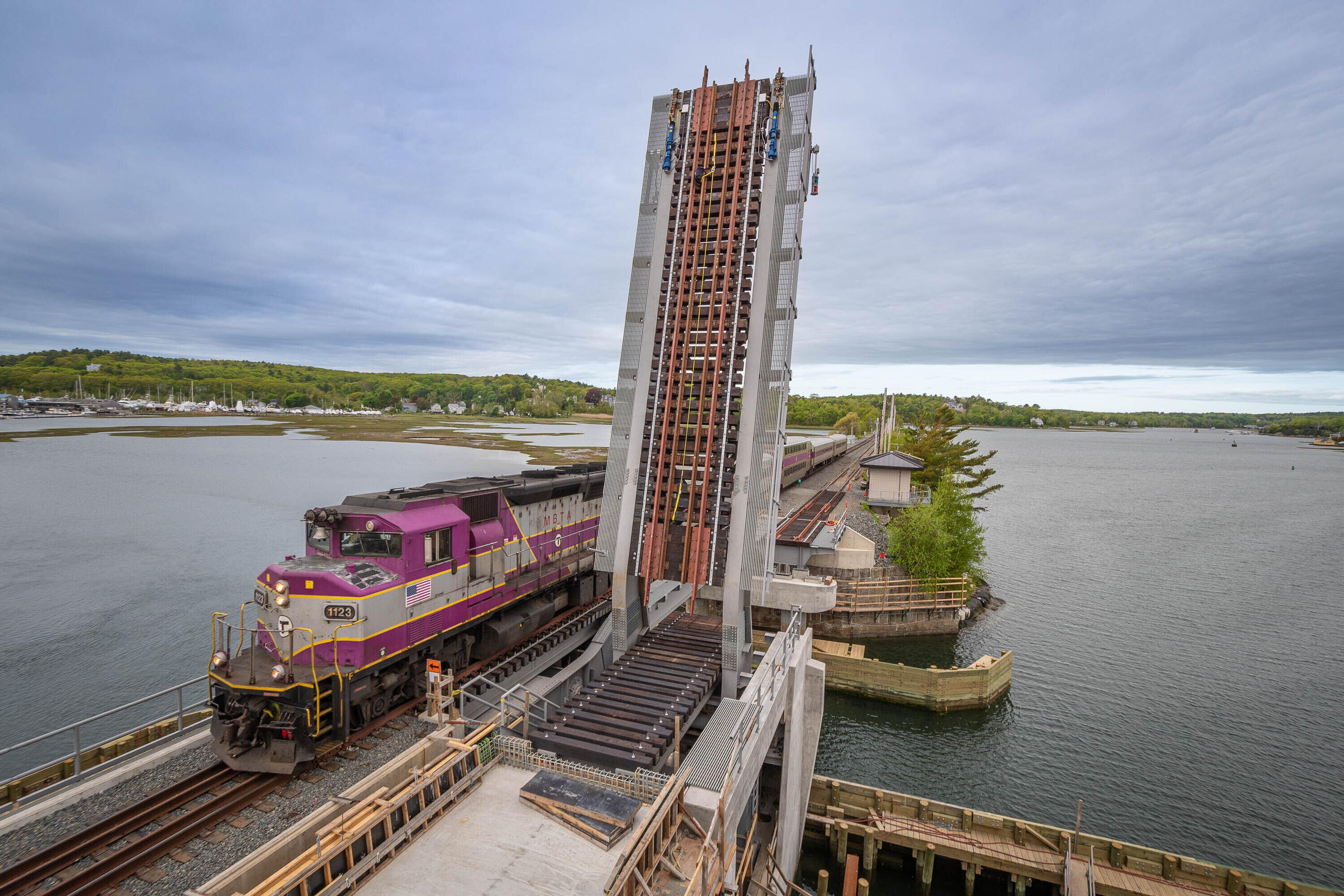 Commuter rail train operating on single lane of Gloucester bridge, other lane is lifted