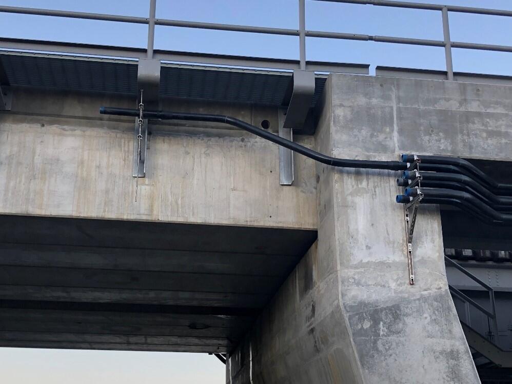 Conduits along bridge