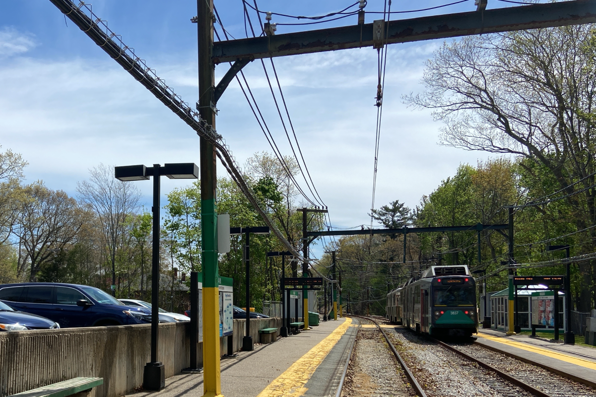 Train running at Eliot Station where track and station crossings will be upgraded this fall (September 2022)