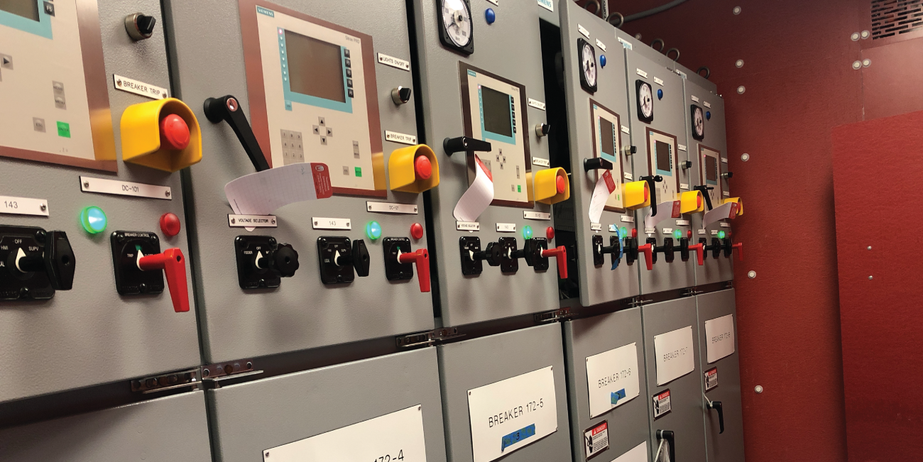a wall of signals, buttons, and switches