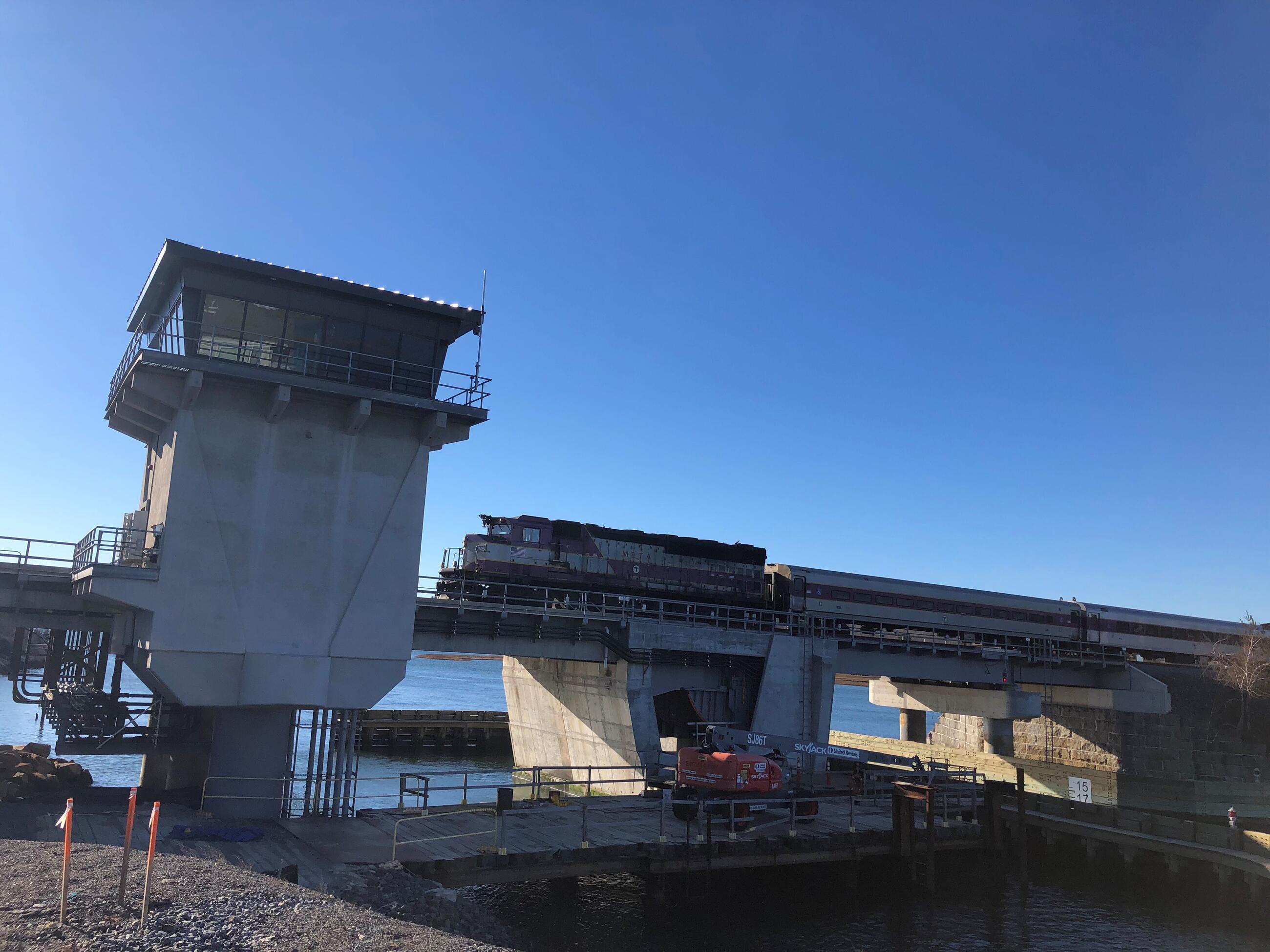 Image of train crossing drawbridge towards control tower