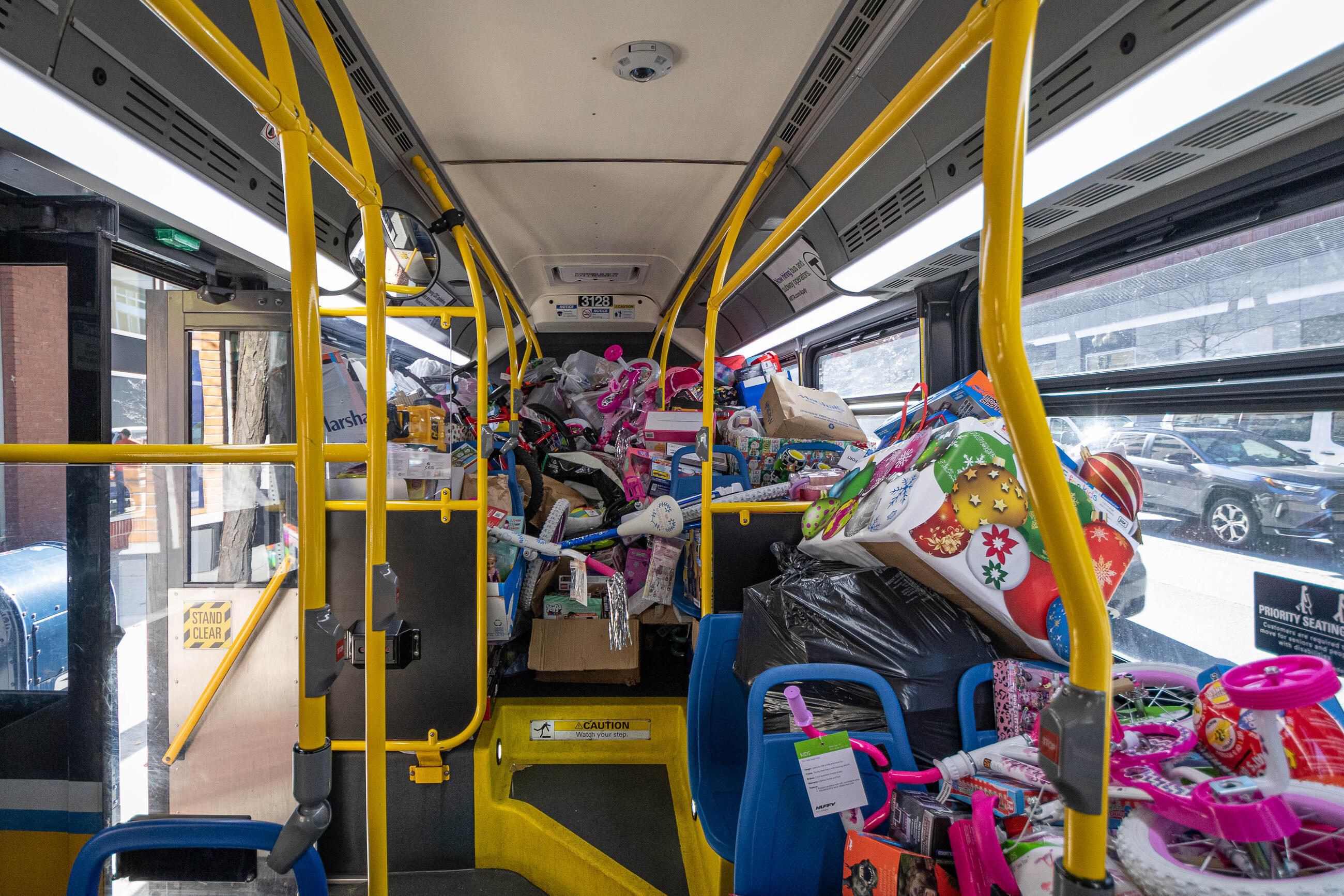 MBTA and MassDOT employees filled a bus with nearly 2,450 gifts – the highest-ever toy count for the Fill-A-Bus gift drive.