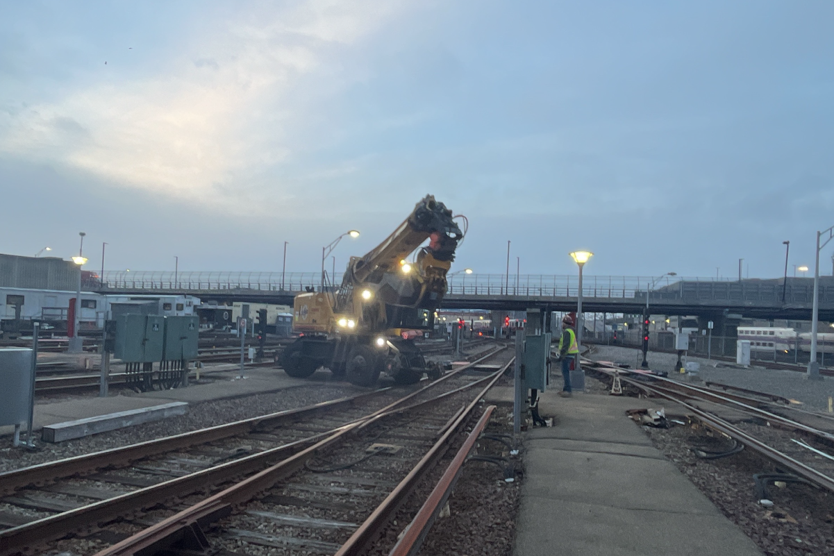 construction equipment by the tracks at dawn