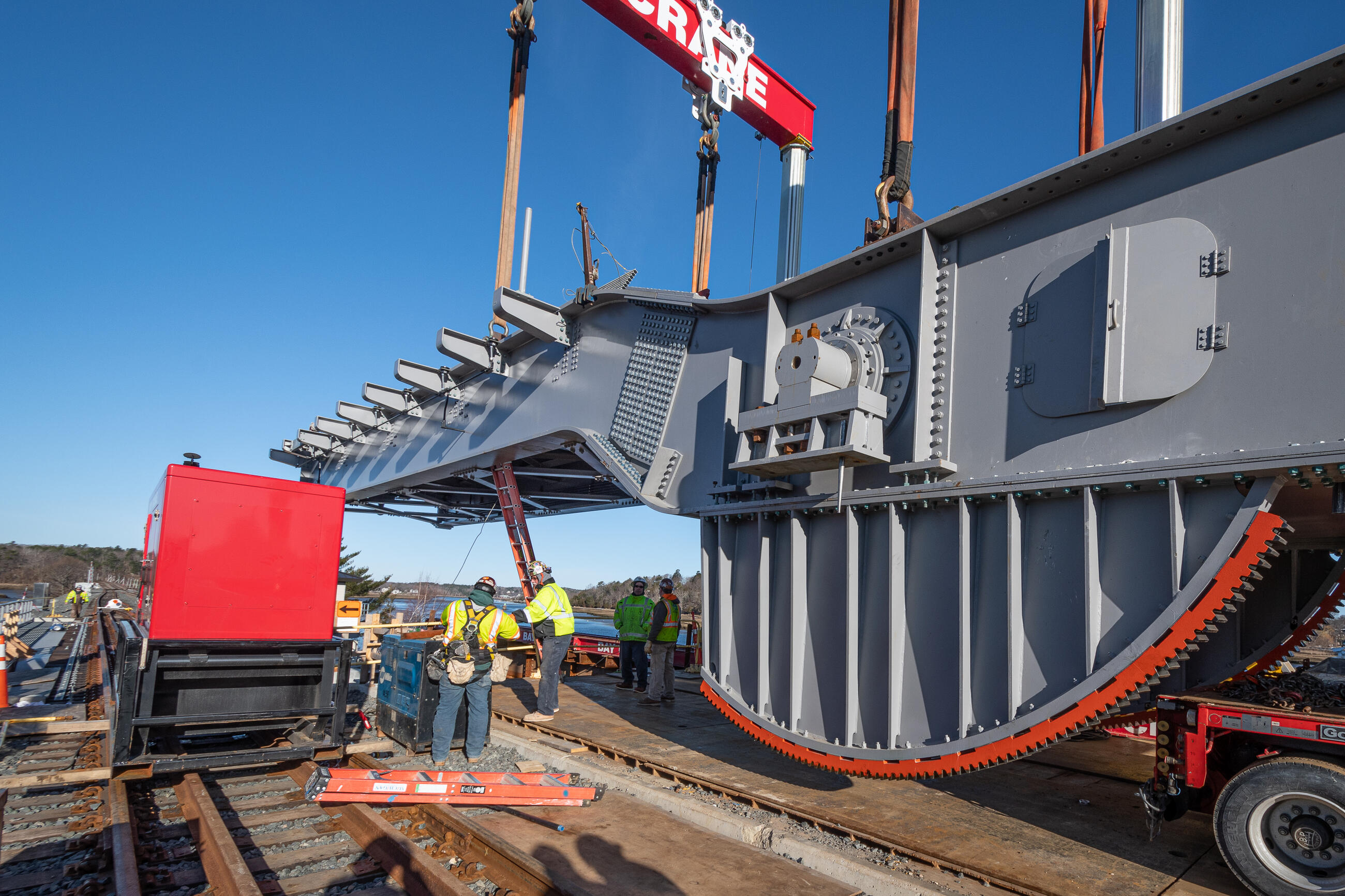 Construction workers install a new bascule on the gloucester drawbridge. A bascule is the movable section of bridge that is raised and lowered.