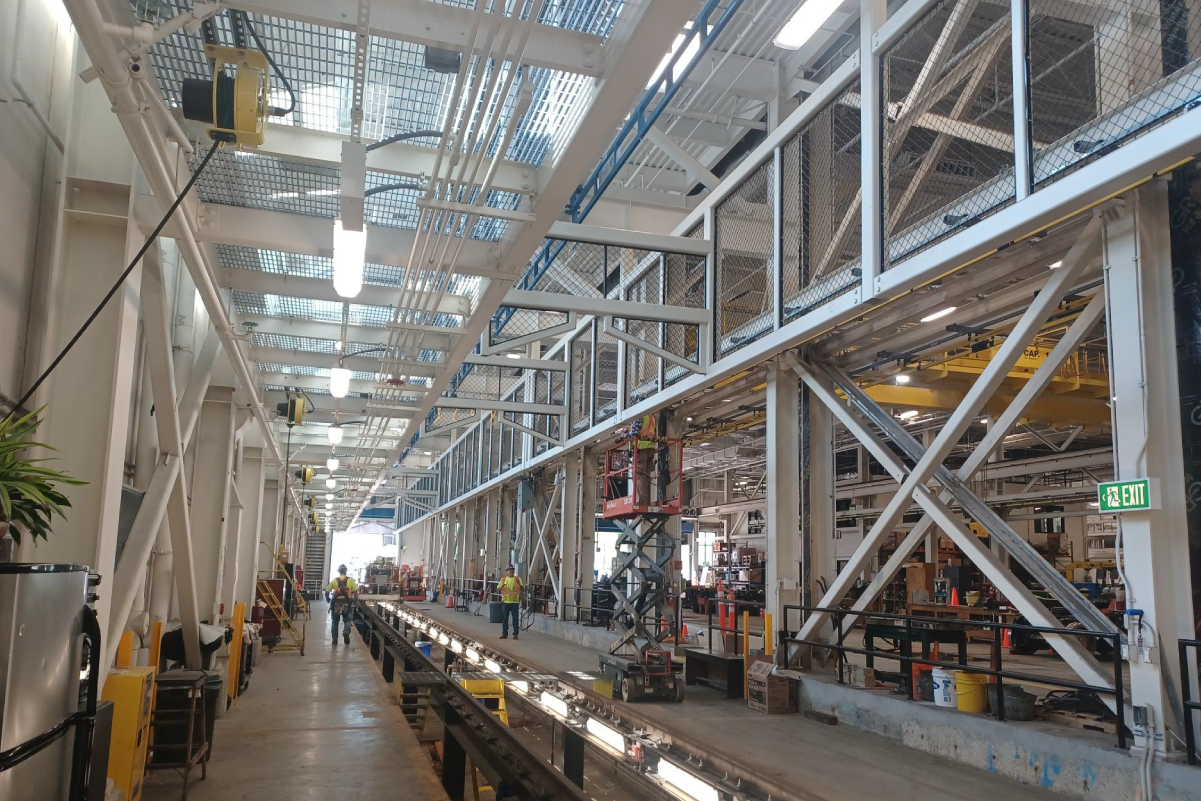 a very white and bright warehouse looking interior of wellington vehicle maintenance facility