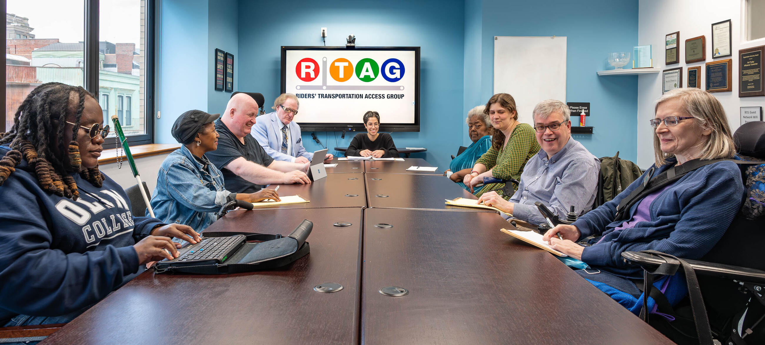 People sitting around a conference table at an RTAG meeting