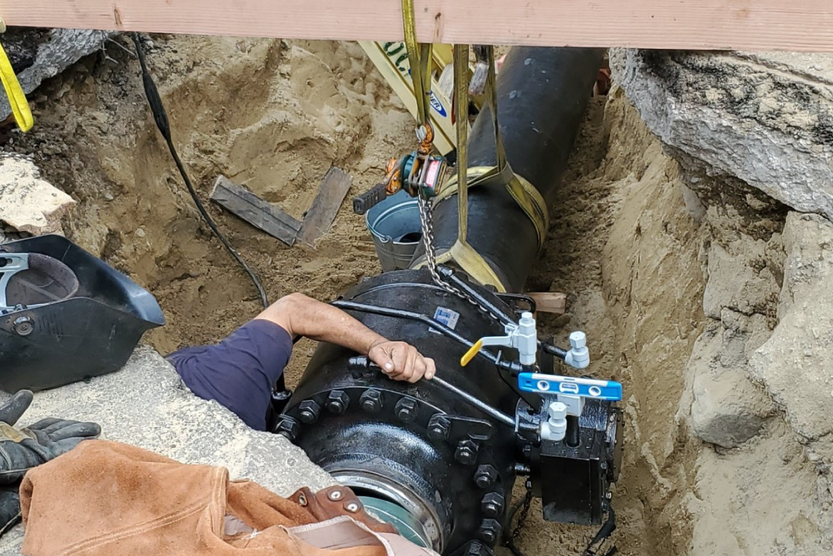 a pipe connected to another pipe in a dirt hole