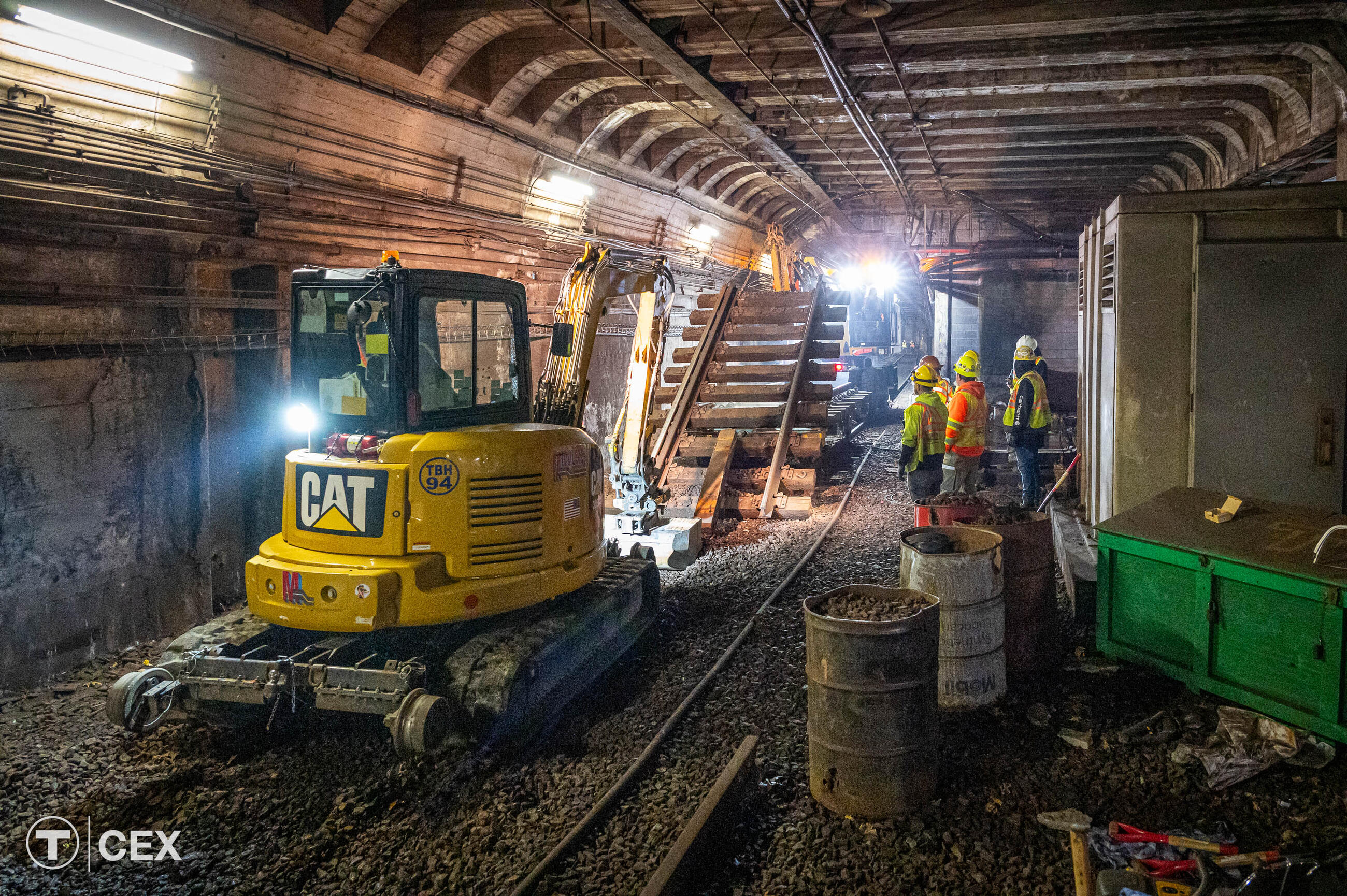 Crews performing track and tie replacement work near Arlington station.