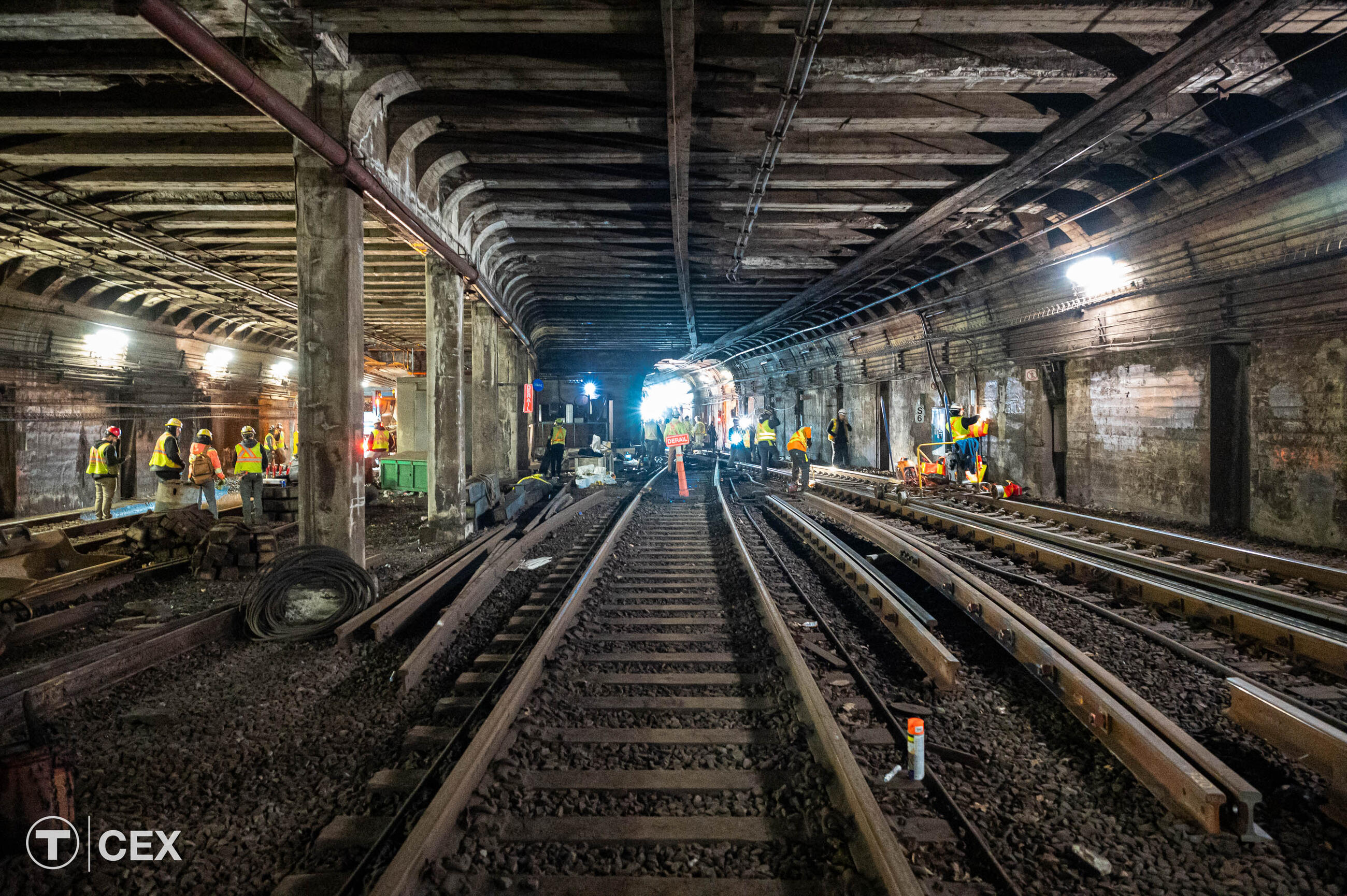 Crews performing track and tunnel work near Arlington Station.